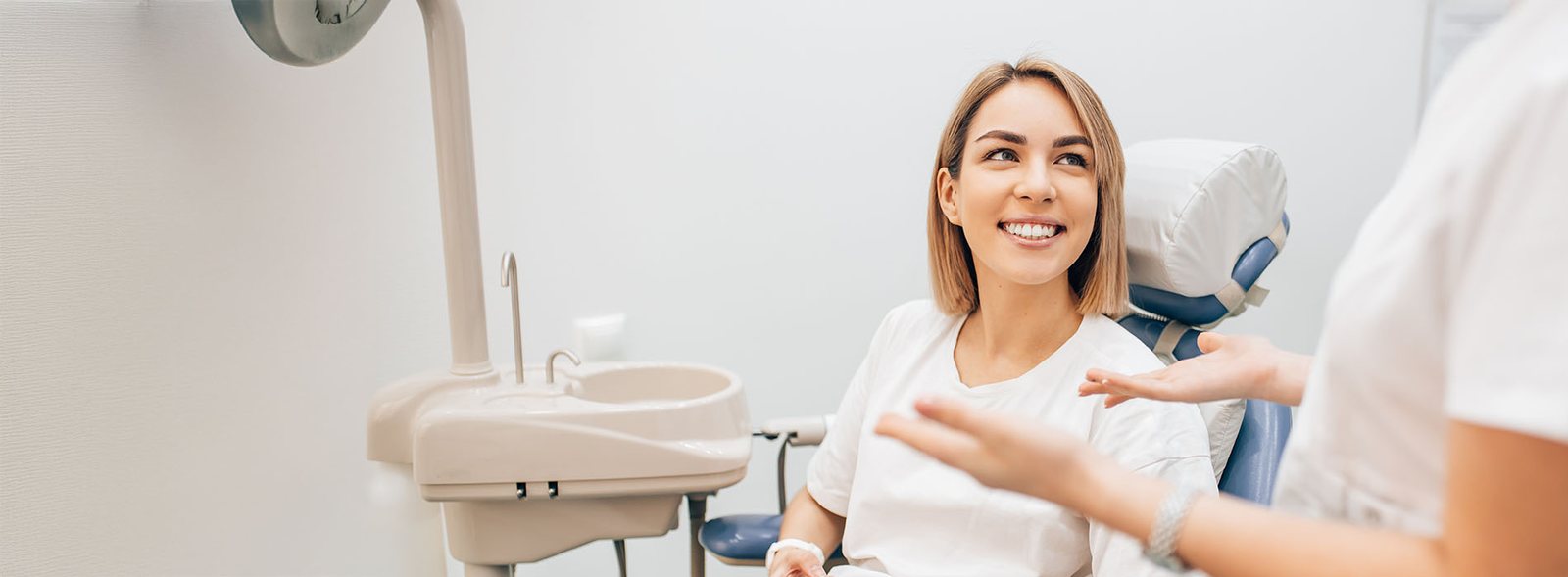 Relaxed patient talking with the dental team