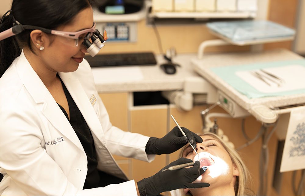 Dentist treating a patient at Prestige Dentistry